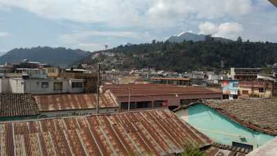 View from our balcony. I love the sound of rain on all those tin roofs!